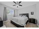 Comfortable bedroom with plush carpeting, a ceiling fan, and a window providing natural light at 2325 Windmill Pkwy # 1124, Henderson, NV 89074