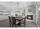 Charming dining room featuring a cozy fireplace and stylish light fixture, perfect for memorable gatherings at 2325 Windmill Pkwy # 1124, Henderson, NV 89074