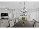 Open floor plan featuring a dining area that flows into a living space and kitchen, ideal for modern living at 2325 Windmill Pkwy # 1124, Henderson, NV 89074
