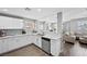 Well-lit kitchen with sleek countertops, stainless steel appliances, and an open view to the cozy living area at 2325 Windmill Pkwy # 1124, Henderson, NV 89074