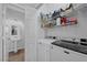 Well-equipped laundry room featuring modern washer and dryer with ample storage space at 2325 Windmill Pkwy # 1124, Henderson, NV 89074