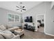 Comfortable living room with plush seating, a ceiling fan, and a view into the serene bedroom at 2325 Windmill Pkwy # 1124, Henderson, NV 89074