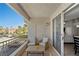 Scenic patio featuring comfortable seating, neighborhood views, and sliding door access to interior at 2325 Windmill Pkwy # 1124, Henderson, NV 89074