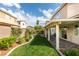 Beautiful backyard with manicured lawn, patio, and tasteful landscaping, great for relaxing and entertaining at 2418 Brockton Way, Henderson, NV 89074