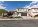 Charming two-story home featuring a well-manicured front yard and attached two-car garage at 2418 Brockton Way, Henderson, NV 89074