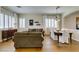 Inviting living room with plantation shutters, neutral decor, and an adjacent dining area at 2418 Brockton Way, Henderson, NV 89074