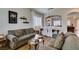 Inviting living room featuring hardwood floors, plantation shutters, and neutral decor at 2418 Brockton Way, Henderson, NV 89074