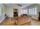 Cozy Gathering room with hardwood floors, a ceiling fan, and plantation shutters at 2418 Brockton Way, Henderson, NV 89074