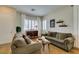 Inviting living room with neutral decor, hardwood floors, and plantation shutters at 2418 Brockton Way, Henderson, NV 89074
