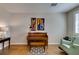 Cozy sitting room featuring a piano and vintage decor at 2418 Brockton Way, Henderson, NV 89074