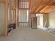 Partially framed basement shows a stainless fridge, a window for natural light, and visible construction elements at 2471 Old Forge Ln # 103, Las Vegas, NV 89121