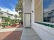 Apartment entrance features a sidewalk, a clean walkway to the front door, and low maintenance landscaping at 2471 Old Forge Ln # 103, Las Vegas, NV 89121