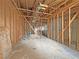 Interior view showing the wooden framing and structure of a large unfinished room in renovation at 2471 Old Forge Ln # 103, Las Vegas, NV 89121