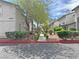 A street-level view shows mature landscaping, well-maintained walkways, and accessible parking at 2471 Old Forge Ln # 103, Las Vegas, NV 89121