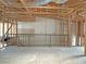 View of a second story construction site shows bare wood framing and the staircase access below at 2471 Old Forge Ln # 103, Las Vegas, NV 89121