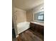 Bathroom features a combined tub and shower with tile surround and granite vanity at 2700 N Rainbow Blvd # 1084, Las Vegas, NV 89108