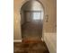 Bathroom featuring an arched doorway leading into a neutrally decorated bedroom at 2700 N Rainbow Blvd # 1084, Las Vegas, NV 89108