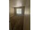 A cozy bedroom features a window providing natural light and neutral colored carpet at 2700 N Rainbow Blvd # 1084, Las Vegas, NV 89108