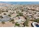Aerial view of a home with solar panels in a desert community at 3004 Canton Hills St, Henderson, NV 89052