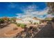Large backyard featuring desert landscaping, defined planter beds, and plenty of open space at 3004 Canton Hills St, Henderson, NV 89052