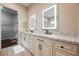 Stylish bathroom with double vanities, sleek mirrors, and a walk-in closet offering both luxury and practicality at 3004 Canton Hills St, Henderson, NV 89052