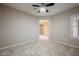 Neutral bedroom with ceiling fan, tile floors, shuttered windows and great natural light at 3004 Canton Hills St, Henderson, NV 89052