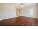 Bright bedroom showcasing hardwood floors and a ceiling fan, offering ample space and natural light at 3004 Canton Hills St, Henderson, NV 89052