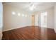 Bedroom with hardwood floors, neutral paint, natural light and access to bathroom at 3004 Canton Hills St, Henderson, NV 89052