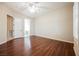 Bright bedroom with hardwood flooring, ceiling fan, and ensuite bathroom access at 3004 Canton Hills St, Henderson, NV 89052