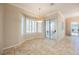 Sunlit dining area featuring tile floors, large windows, and sliding glass doors at 3004 Canton Hills St, Henderson, NV 89052