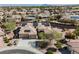 An aerial view shows a home with desert landscaping and three-car garage at 3004 Canton Hills St, Henderson, NV 89052