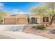 Charming single-story home with three-car garage, desert landscaping, and solar panels at 3004 Canton Hills St, Henderson, NV 89052
