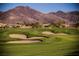Golf course with sand traps and mountain views on a sunny day at 3004 Canton Hills St, Henderson, NV 89052