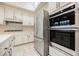 Bright kitchen features stainless steel appliances, double oven, and modern fixtures at 3004 Canton Hills St, Henderson, NV 89052