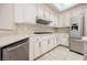 Stylish kitchen showcasing stainless steel appliances, white cabinetry, and tile backsplash at 3004 Canton Hills St, Henderson, NV 89052