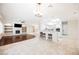 Bright open-concept living space with hardwood floors, fireplace, and bar seating to the kitchen at 3004 Canton Hills St, Henderson, NV 89052