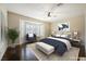 Comfortable main bedroom featuring a bay window, ceiling fan and stylish decor at 3004 Canton Hills St, Henderson, NV 89052