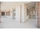 Covered patio area featuring tiled floors, exterior access, and a decorative security gate at 3004 Canton Hills St, Henderson, NV 89052