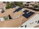 Aerial view of a tile roof featuring solar panels and skylights at 3004 Canton Hills St, Henderson, NV 89052