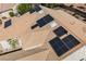 Aerial view of a tile roof featuring solar panels and skylights at 3004 Canton Hills St, Henderson, NV 89052