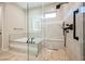 Contemporary shower with multiple shower heads, seating, and sleek glass enclosure, offering a spa-like experience at 3004 Canton Hills St, Henderson, NV 89052