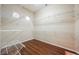 Spacious walk-in closet with hardwood floors and custom adjustable shelving at 3004 Canton Hills St, Henderson, NV 89052