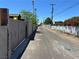 A narrow back alley and cinder block walls bordering the street at 304 S Crestline Dr, Las Vegas, NV 89107