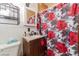 Quaint bathroom featuring a vanity, mirror, and shower with a floral curtain at 304 S Crestline Dr, Las Vegas, NV 89107