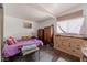 Bedroom with natural light, a warm color palette and wood-look flooring at 304 S Crestline Dr, Las Vegas, NV 89107