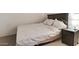 Cozy bedroom featuring a comfortable bed and a convenient nightstand with lamp at 304 S Crestline Dr, Las Vegas, NV 89107