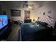 Comfortable bedroom featuring a plush bed, television, and ceiling fan at 304 S Crestline Dr, Las Vegas, NV 89107