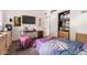 Bedroom features a tv, hard floors and a walk-in closet at 304 S Crestline Dr, Las Vegas, NV 89107