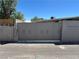 A single Gathering home with a driveway gate and block wall at 304 S Crestline Dr, Las Vegas, NV 89107