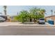 Charming single story home featuring mature trees, desert landscaping, and a spacious driveway at 304 S Crestline Dr, Las Vegas, NV 89107